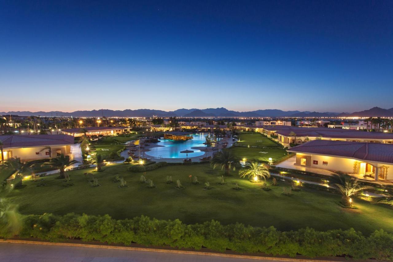 Pickalbatros Golf Beach Resort Sharm el-Sheikh Bagian luar foto View of the resort at night